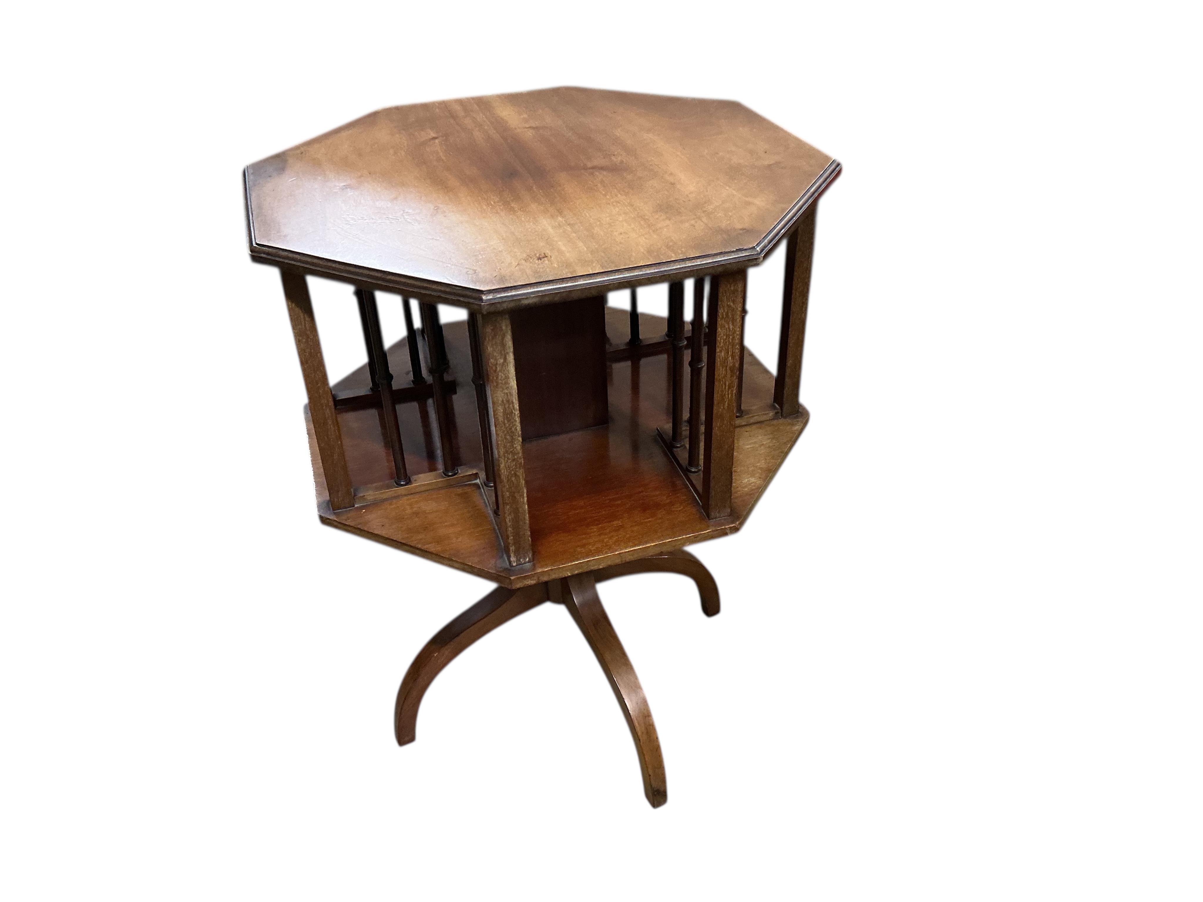 An Edwardian octagonal mahogany revolving book table, width 53cm, height 69cm